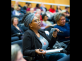 a woman in the audience listening to Jeh Johnson’s morning keynote